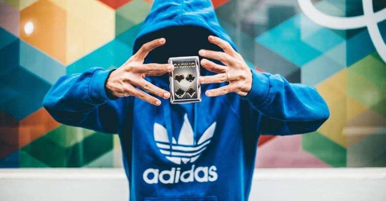Tricks - Man in Blue Adidas Hoodie Doing Magic Trick