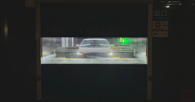 Maintenance Mistakes - A car driving through a tunnel with a light on