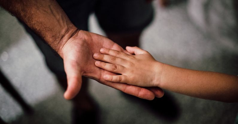 SOG - Father and Child's Hands Together