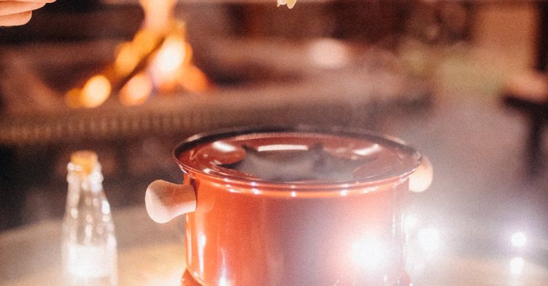 Fire Starter - Cheese fondue on glass table with garland