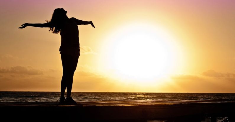 Leatherman Free P4 - Silhouette Photo of Woman Against during Golden Hour