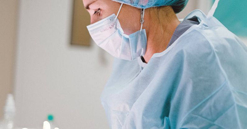 Operating - Female Doctor in Blue Scrub Suit