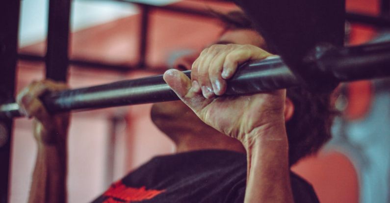Grip - Man In Black Crew-neck Shirt Doing Pull-ups
