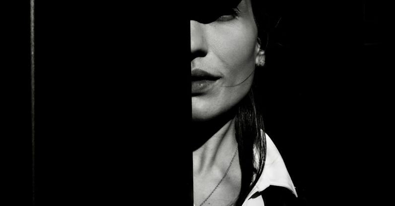 Multi-Tool - A woman is standing behind a door